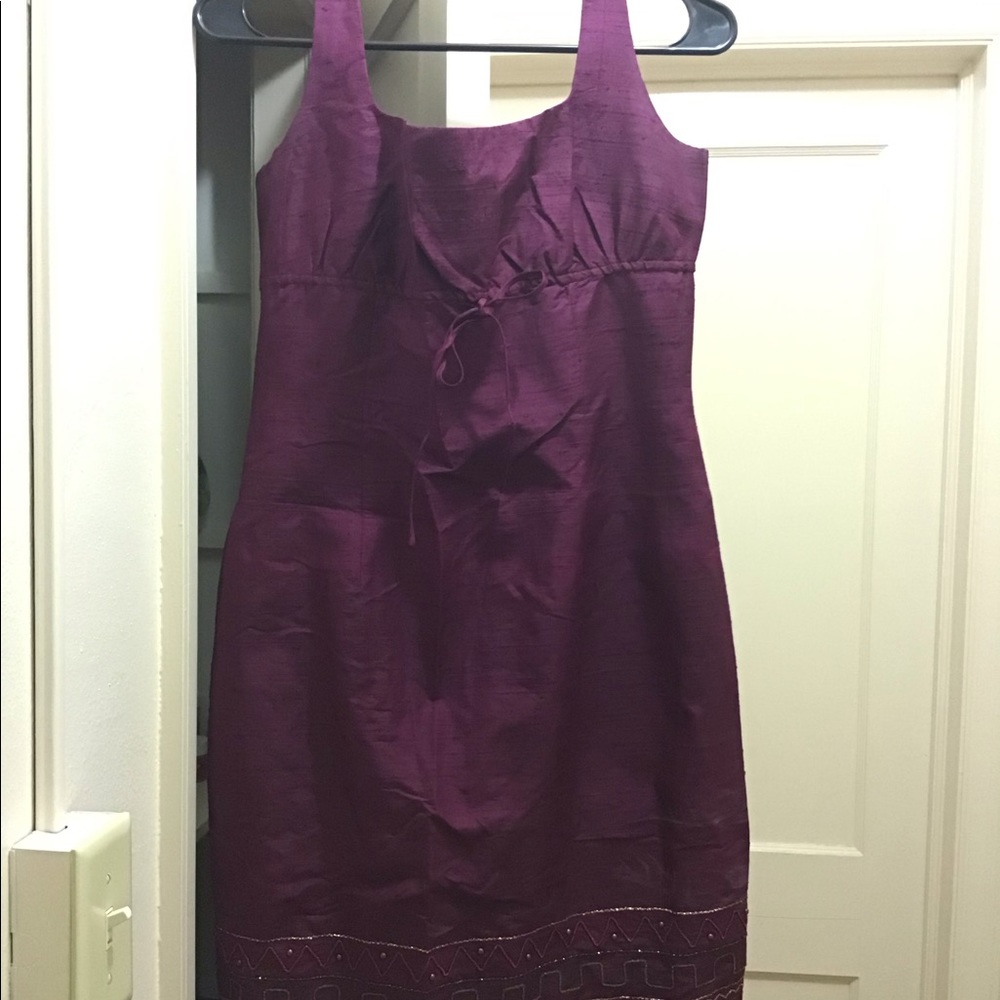 Purple dress with nice detail at the bottom.